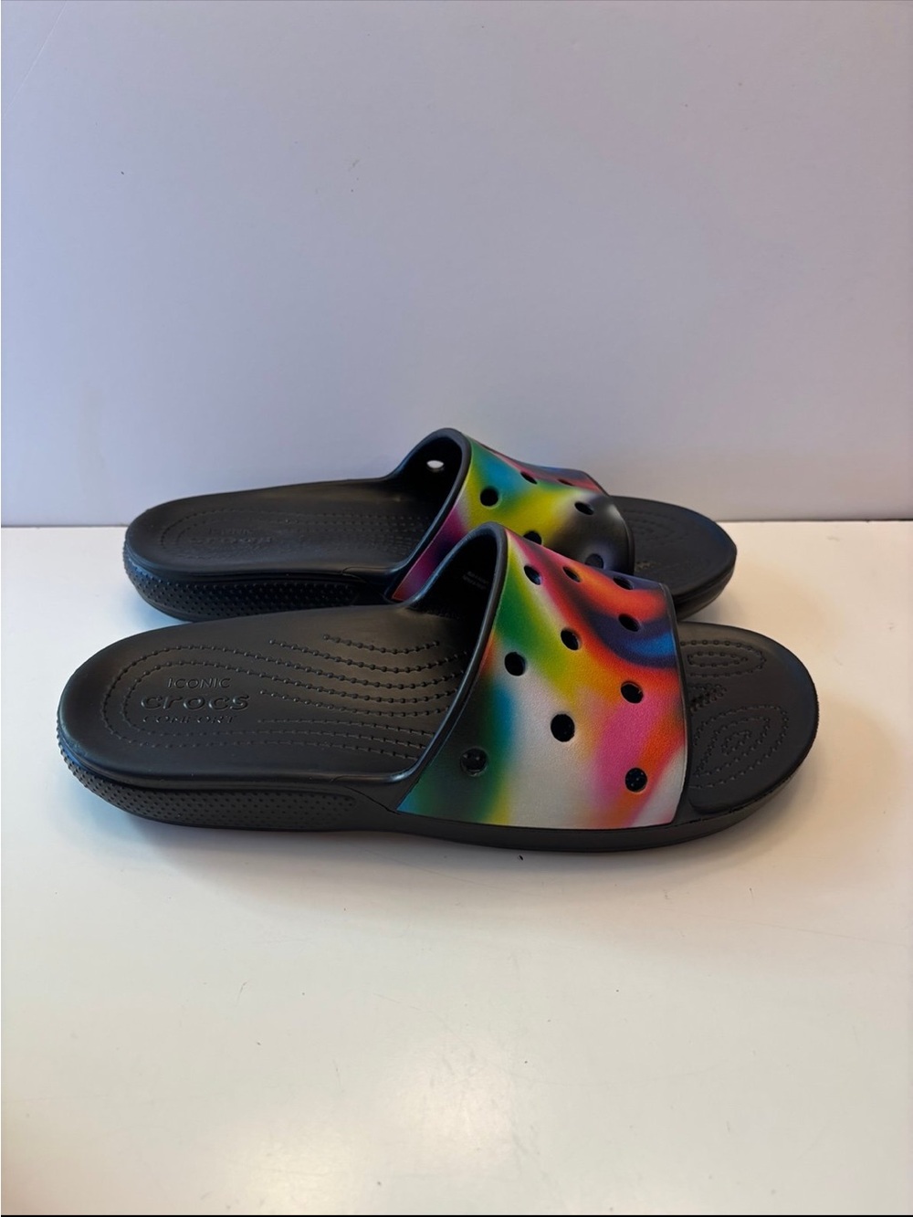 Crocs Classic Solarized Slide Sandals with a vibrant rainbow tie-dye 10M 12W